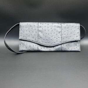 Ostrich black clutch bag with detachable strap.